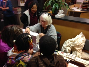 Such a sweet picture of Sandy Wright mending with onlookers